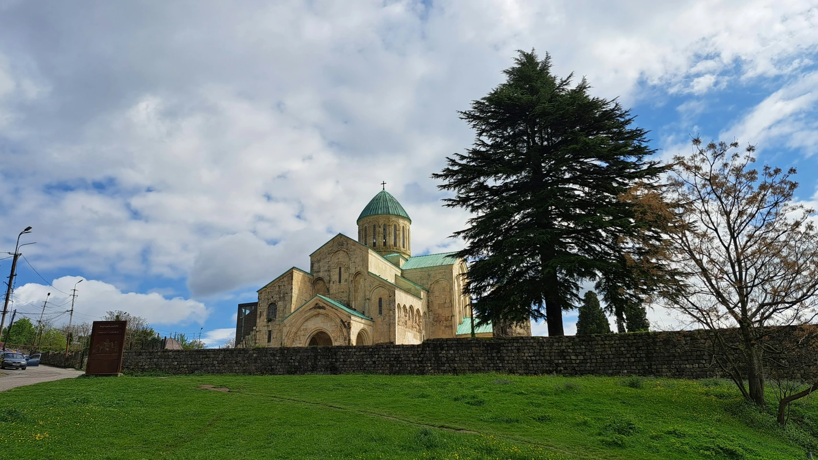 Bagrati Cathedral on a lush green hillside in Kutaisi - a landmark reached easily with a rental car